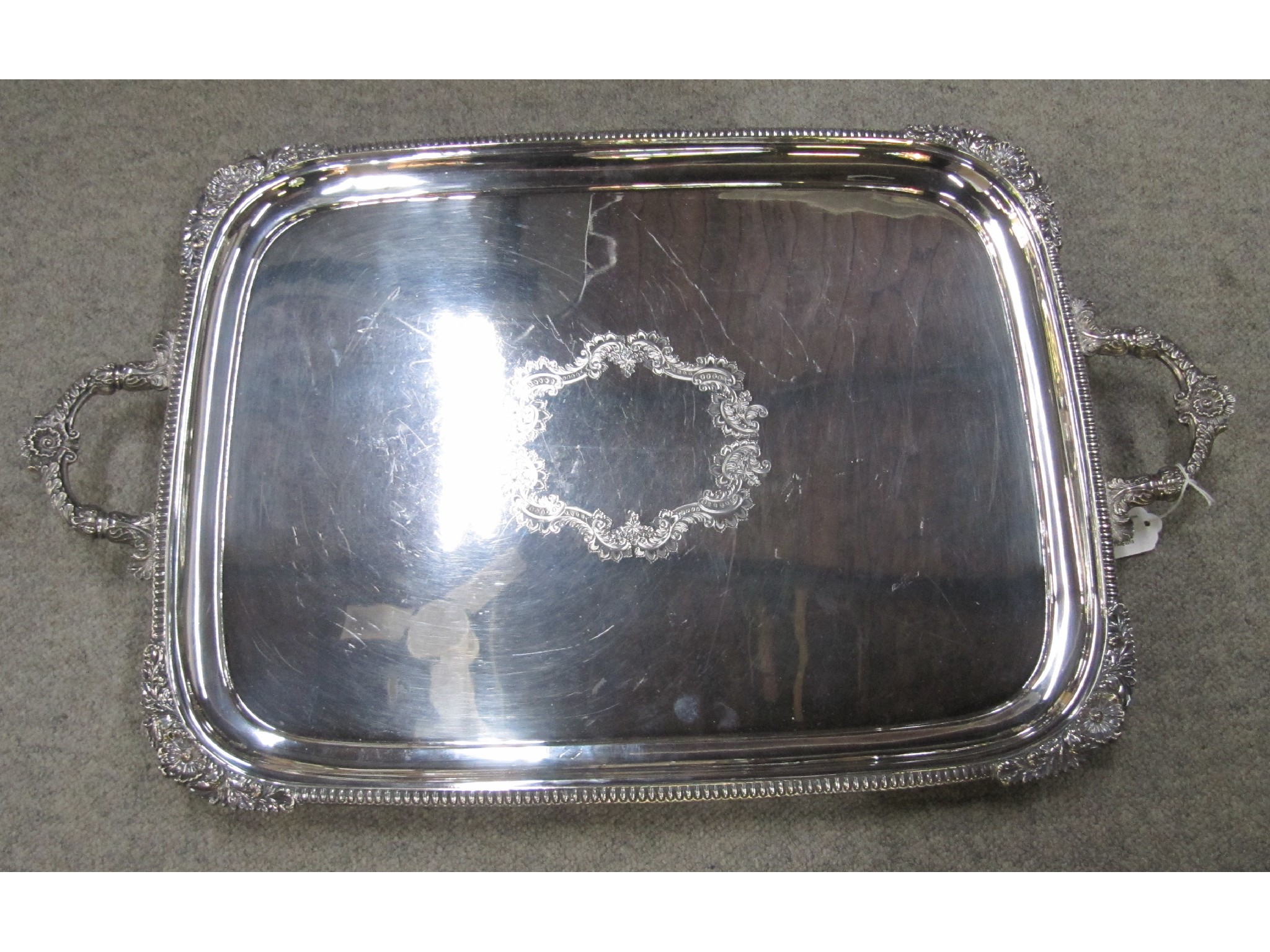 Appraisal: A silver plated double handled serving tray