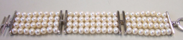 Appraisal: A four row bracelet of cultured pearls with H shaped