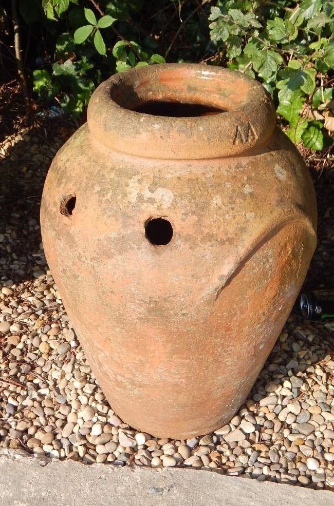 Appraisal: A terracotta vase with two handles later adapted and AF