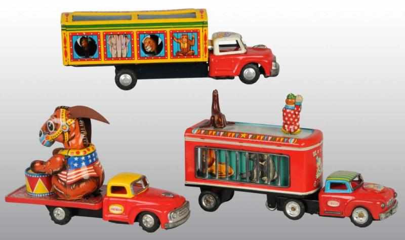 Appraisal: Lot of Tin Circus Vehicle Friction Toys Description Japanese Working