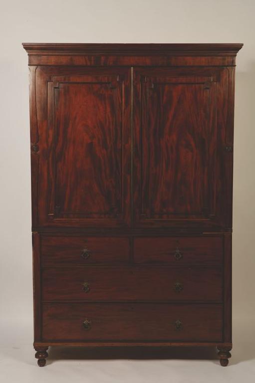 Appraisal: A REGENCY MAHOGANY LINEN PRESS with a moulded cornice above