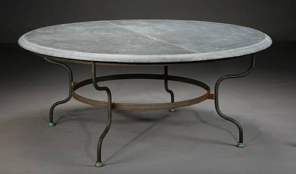 Appraisal: A Baroque style slate and iron table The circular divided