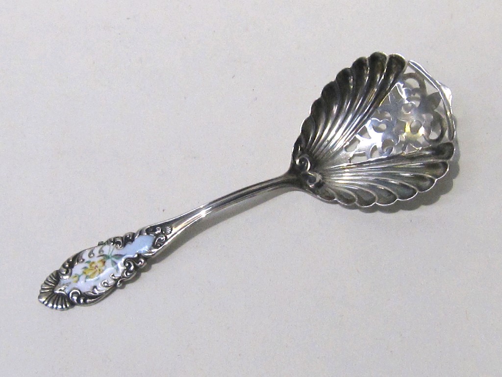 Appraisal: Sterling silver and enamel sifter spoon