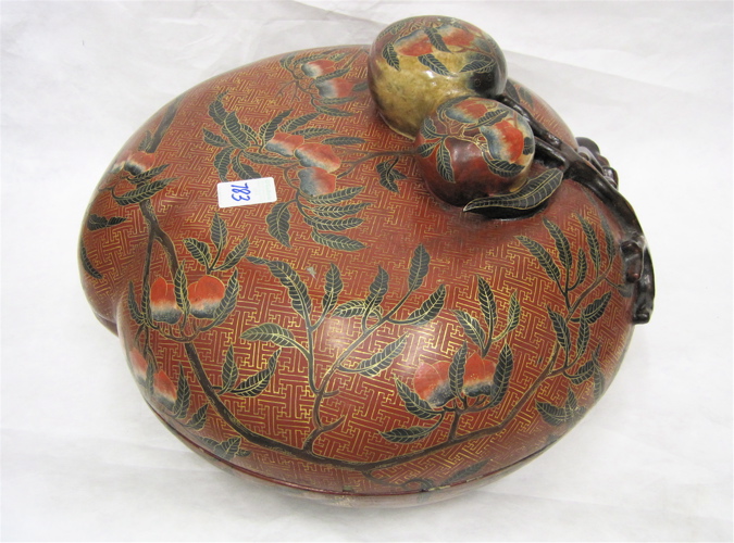 Appraisal: CHINESE RED LACQUER PEACH-FORM BOX the dome lid concealing an