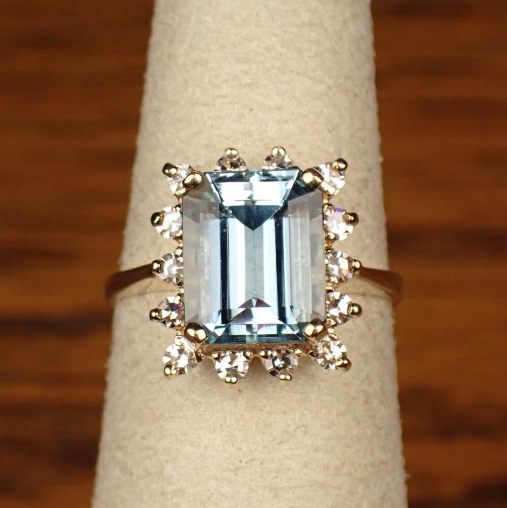 Appraisal: AQUAMARINE DIAMOND AND FOURTEEN KARAT GOLD RING with round-cut diamonds