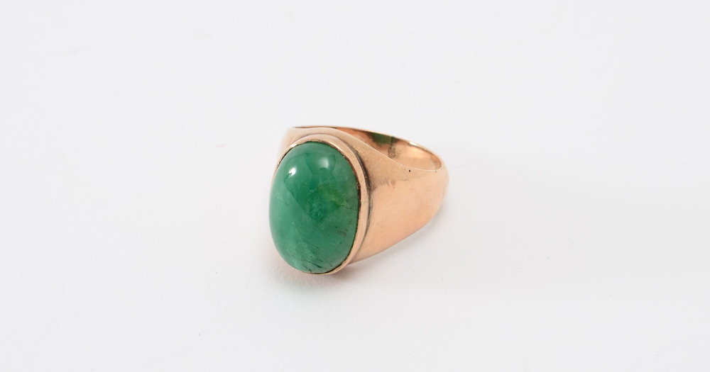 Appraisal: CT CABOCHON EMERALD RING K yellow gold ring centers one