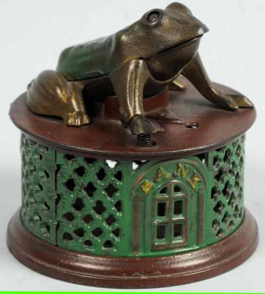 Appraisal: Cast Iron Frog on Lattice Mechanical Bank Manufactured by J