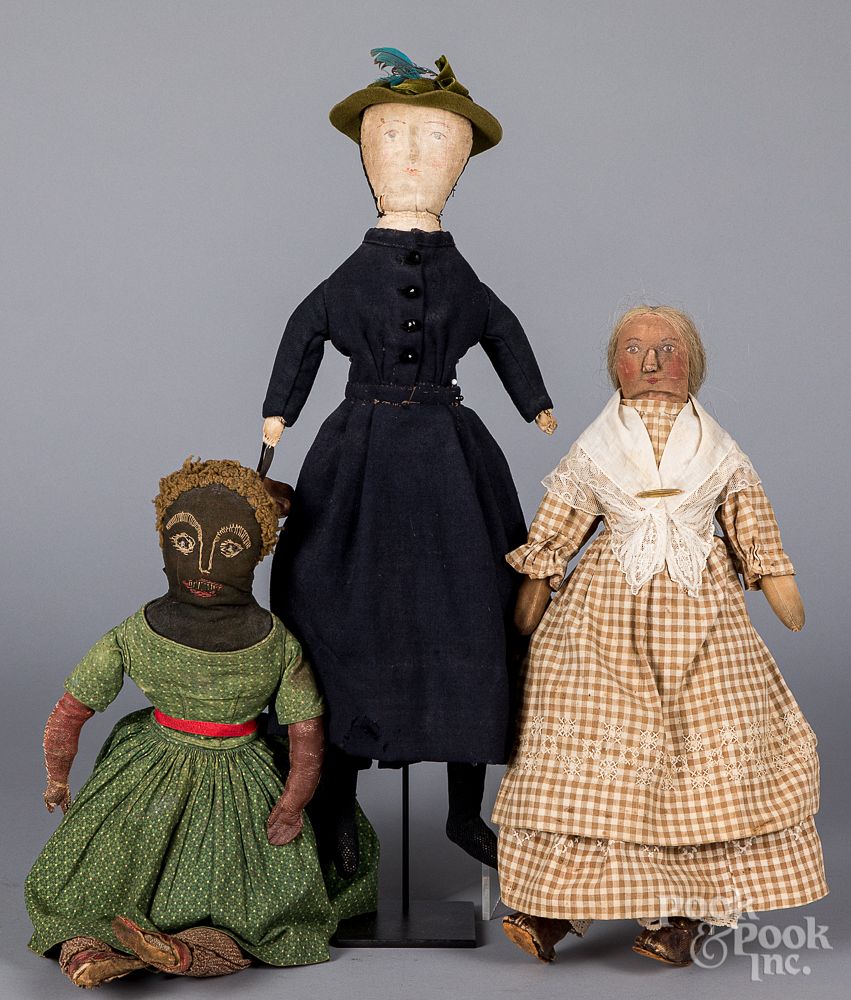 Appraisal: Three early folk art cloth dolls Three early folk art