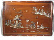 Appraisal: A Chinese hardwood tray or wall plaque inlaid with engraved