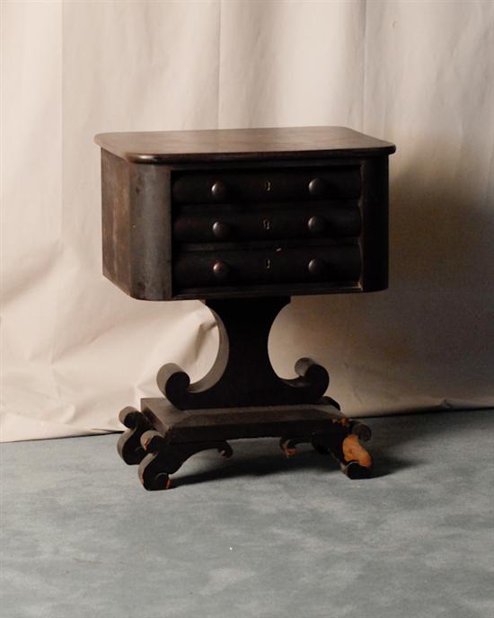 Appraisal: An Empire Mahogany Three-drawer Work Table having a shaped top