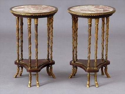 Appraisal: PAIR OF LOUIS XVI-STYLE GILT-METAL MOUNTED MAHOGANY GUERIDONS Each circular