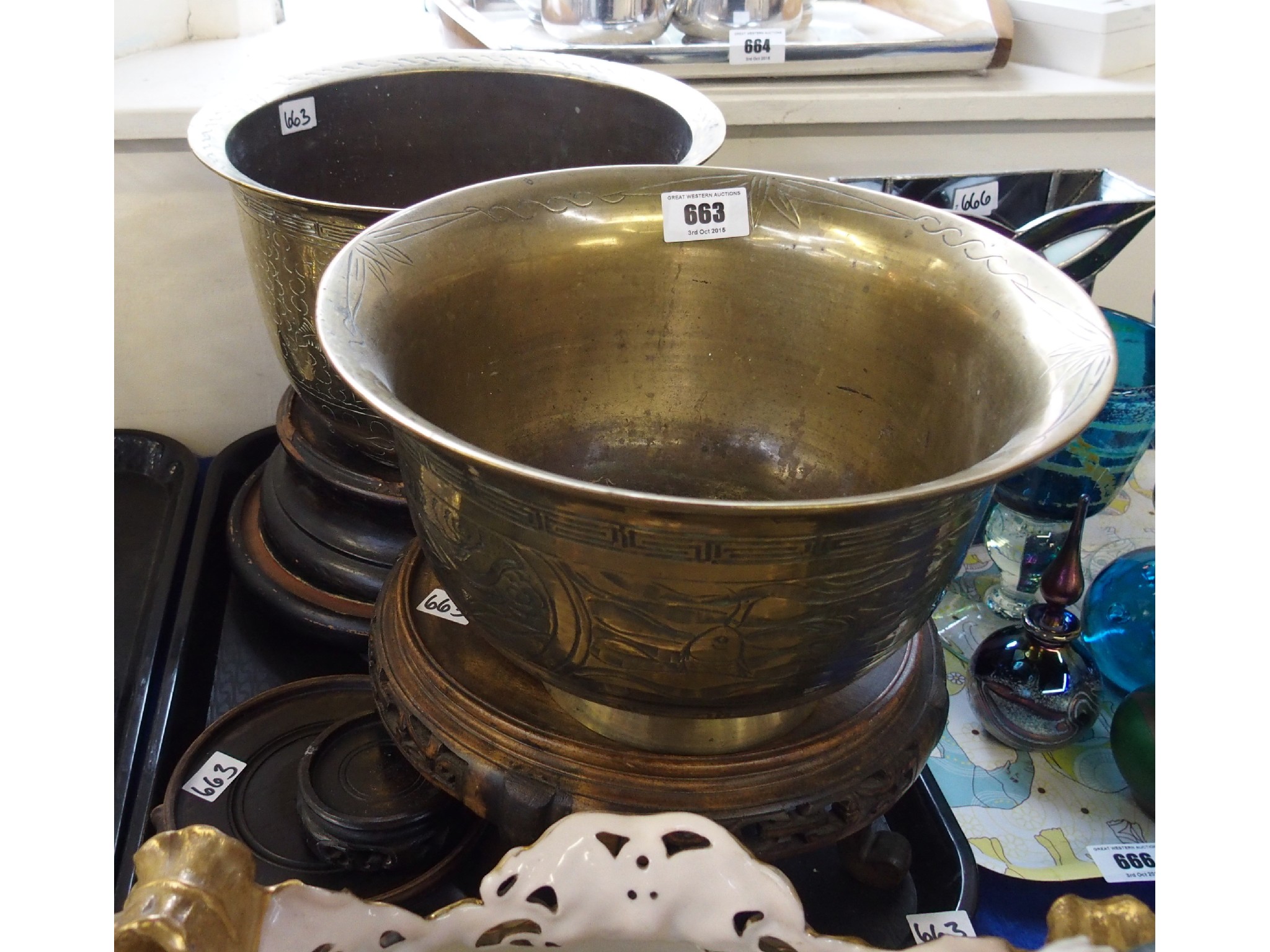 Appraisal: Tray comprising two brass jardinieres with five carved wood stands