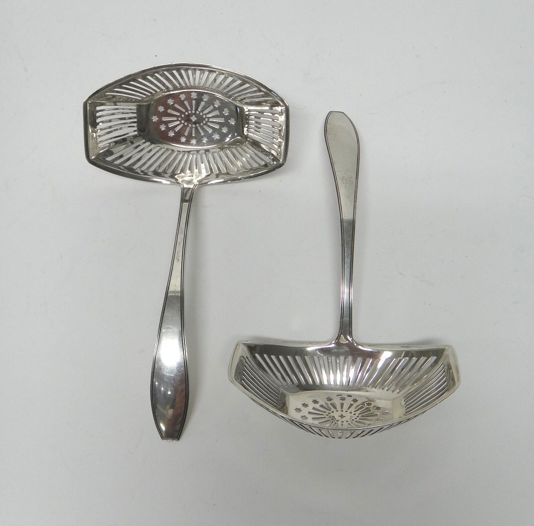 Appraisal: A pair of European sugar sifting ladles the handles with