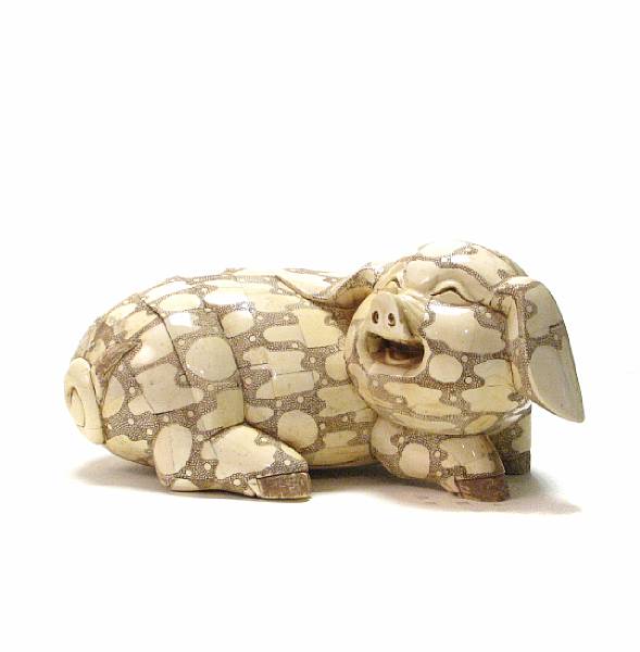 Appraisal: A carved and enameled bone veneer figure of a pig