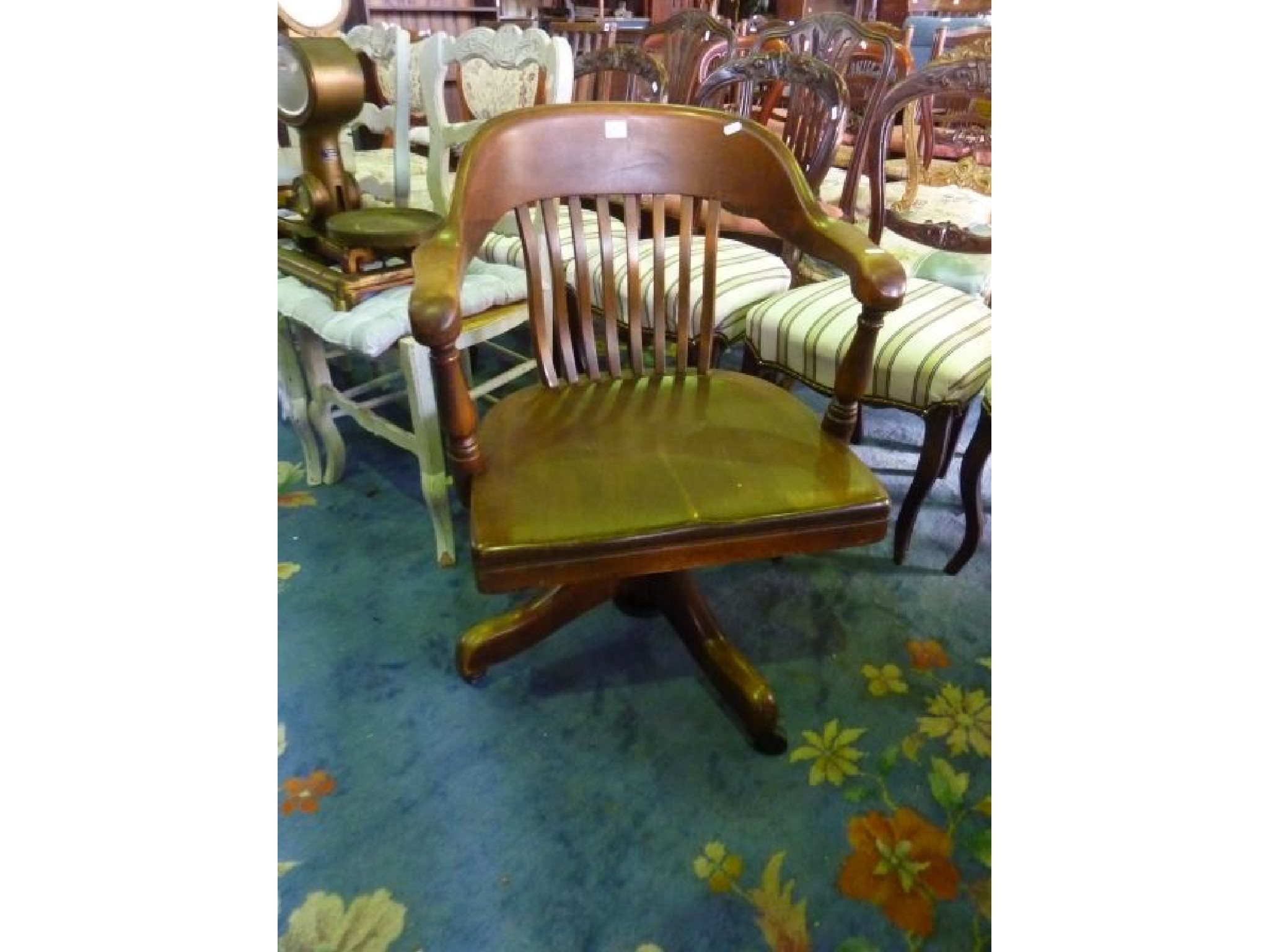 Appraisal: An Edwardian office chair with stickback and swivel base