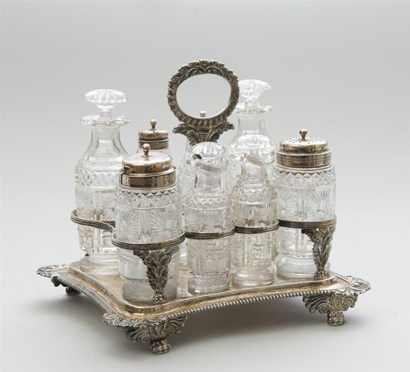 Appraisal: REGENCY SILVER CRUET FRAME FITTED WITH FOUR SILVER-LIDDED GLASS CRUETS