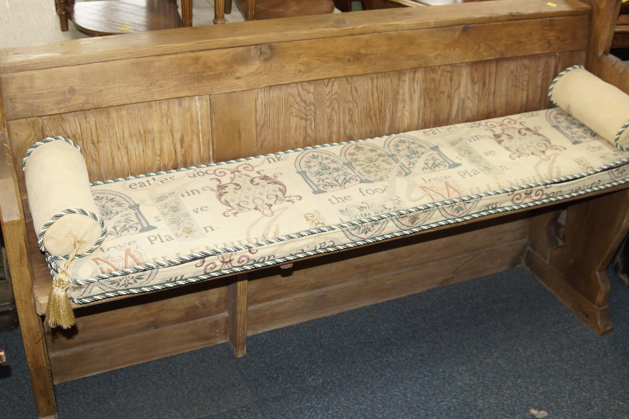 Appraisal: A pine bench seat with panelled back with a loose