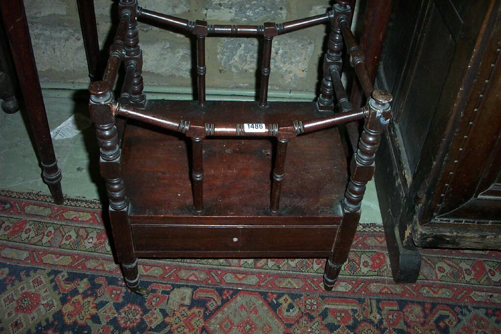 Appraisal: A Georgian mahogany Canterbury with frieze drawer turned supports and