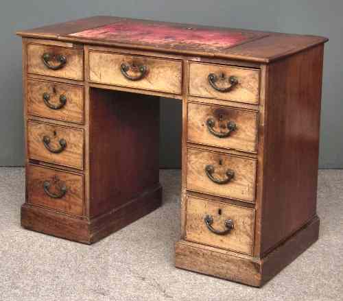 Appraisal: A George III mahogany kneehole desk the top with red