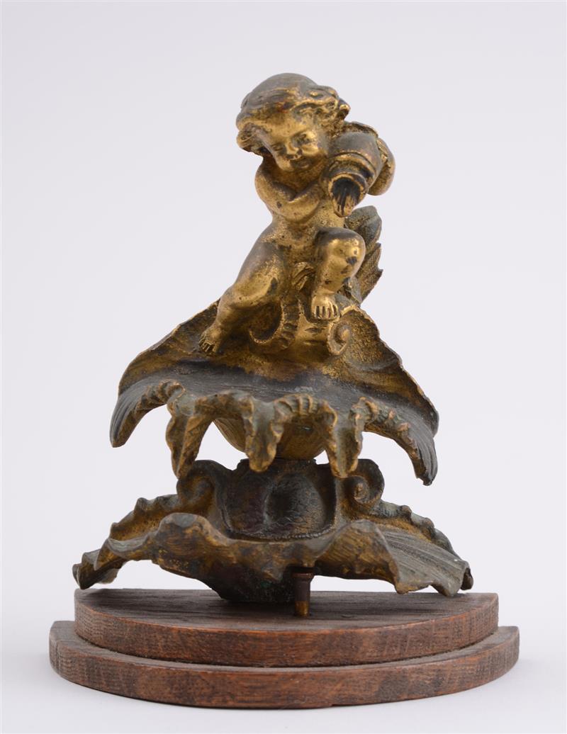 Appraisal: ITALIAN GILT-METAL FIGURE OF A PUTTO The putto is pouring