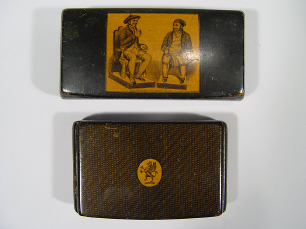 Appraisal: Two wooden snuff boxes one with griffin decoration the other