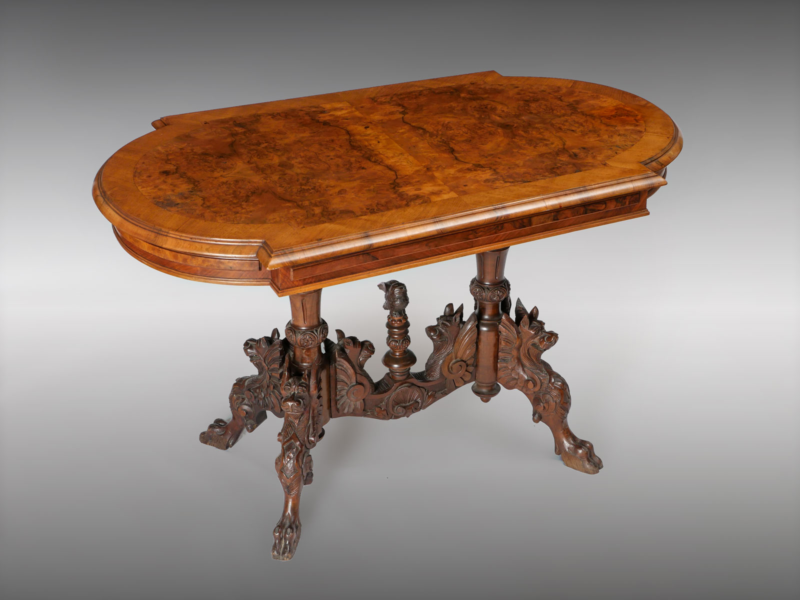 Appraisal: CARVED DRAGON BASE TABLE Burlwood book match table top with