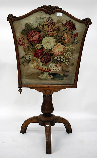 Appraisal: A VICTORIAN OAK FIRE SCREEN with needlework inset panel and