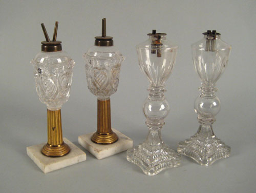 Appraisal: Two pressed colorless glass fluid lamps ca with marble bases