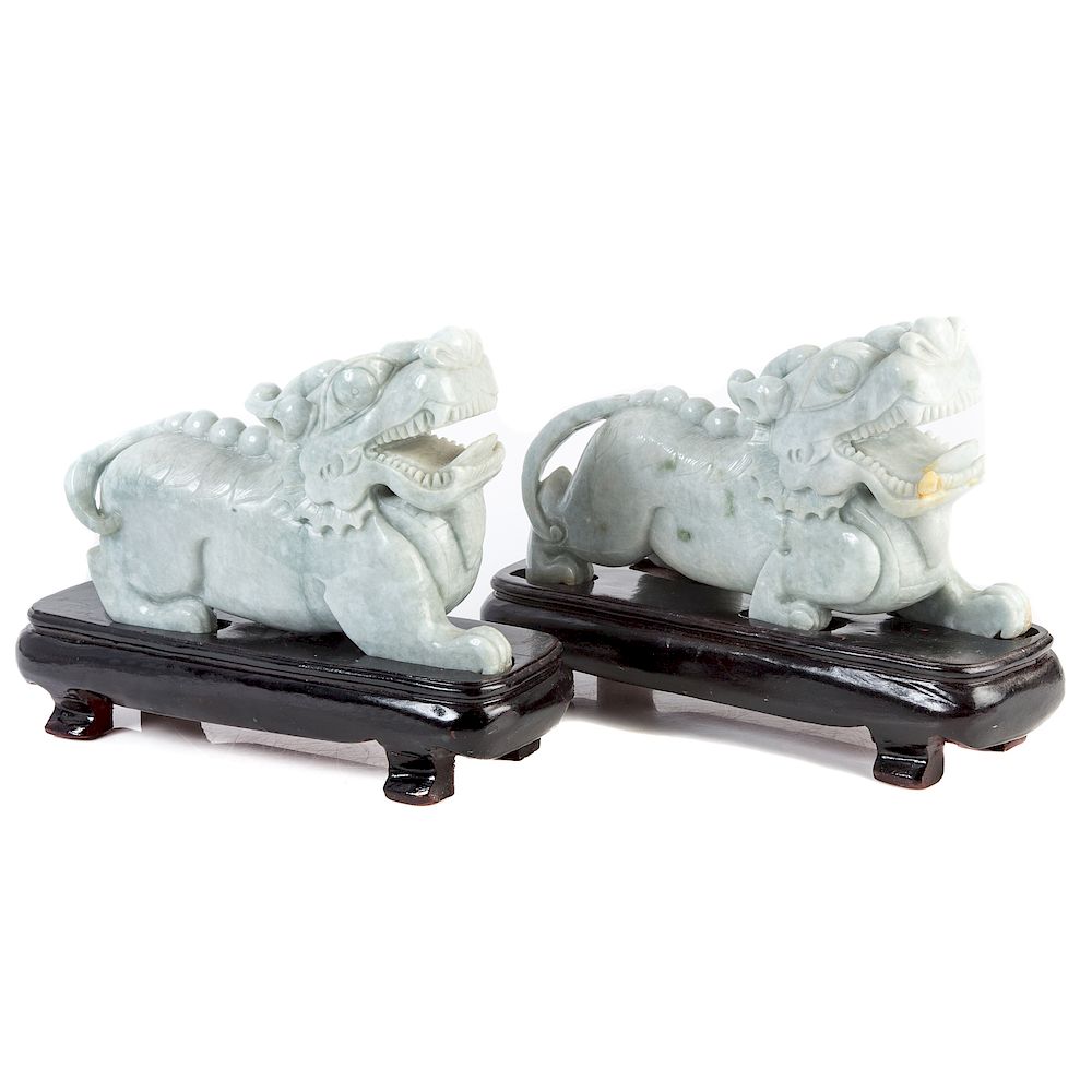 Appraisal: Pair Chinese Carved Jade Dragons with carved wood fitted stands