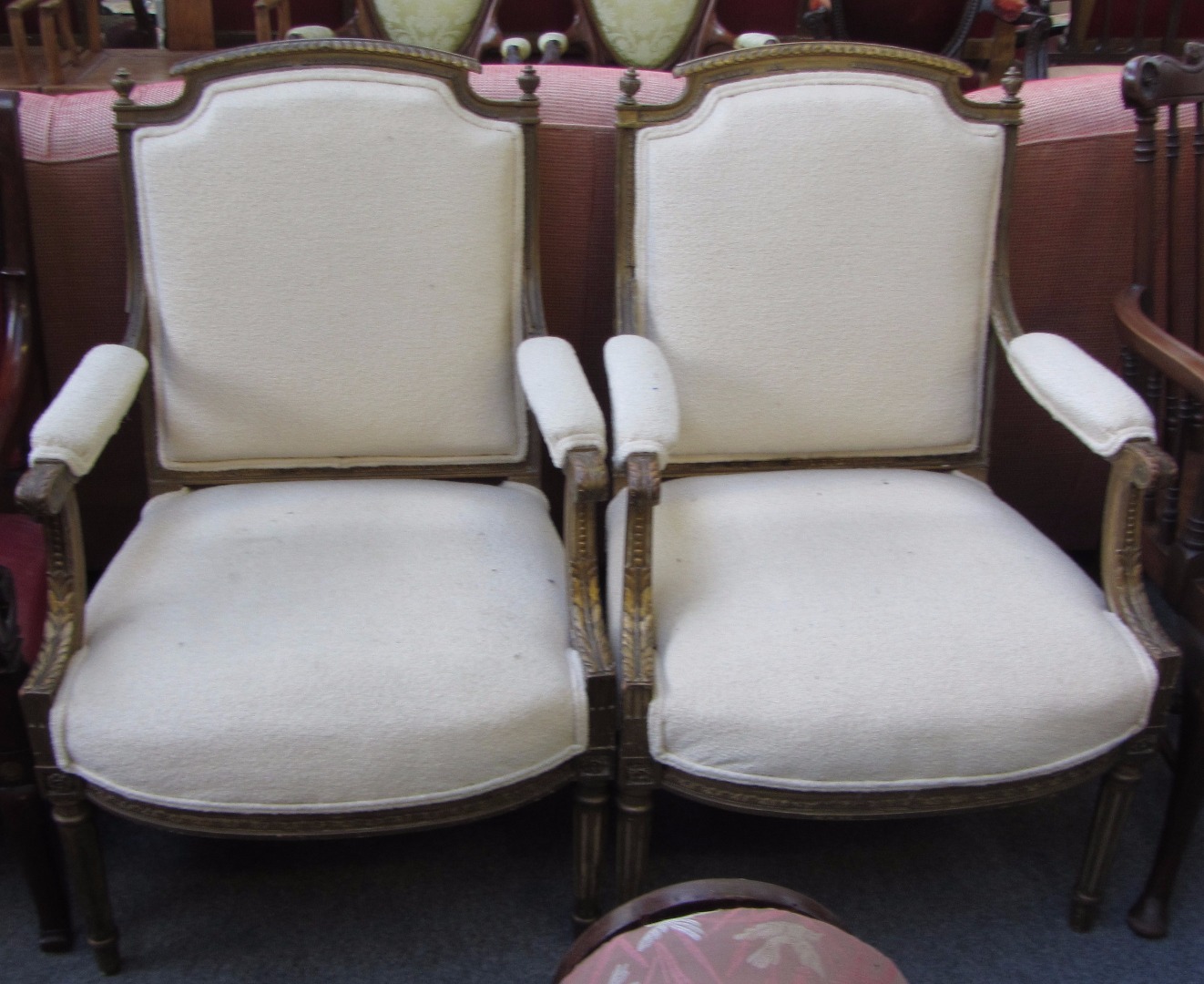 Appraisal: A pair of Louis XV style gilt framed fauteuils on