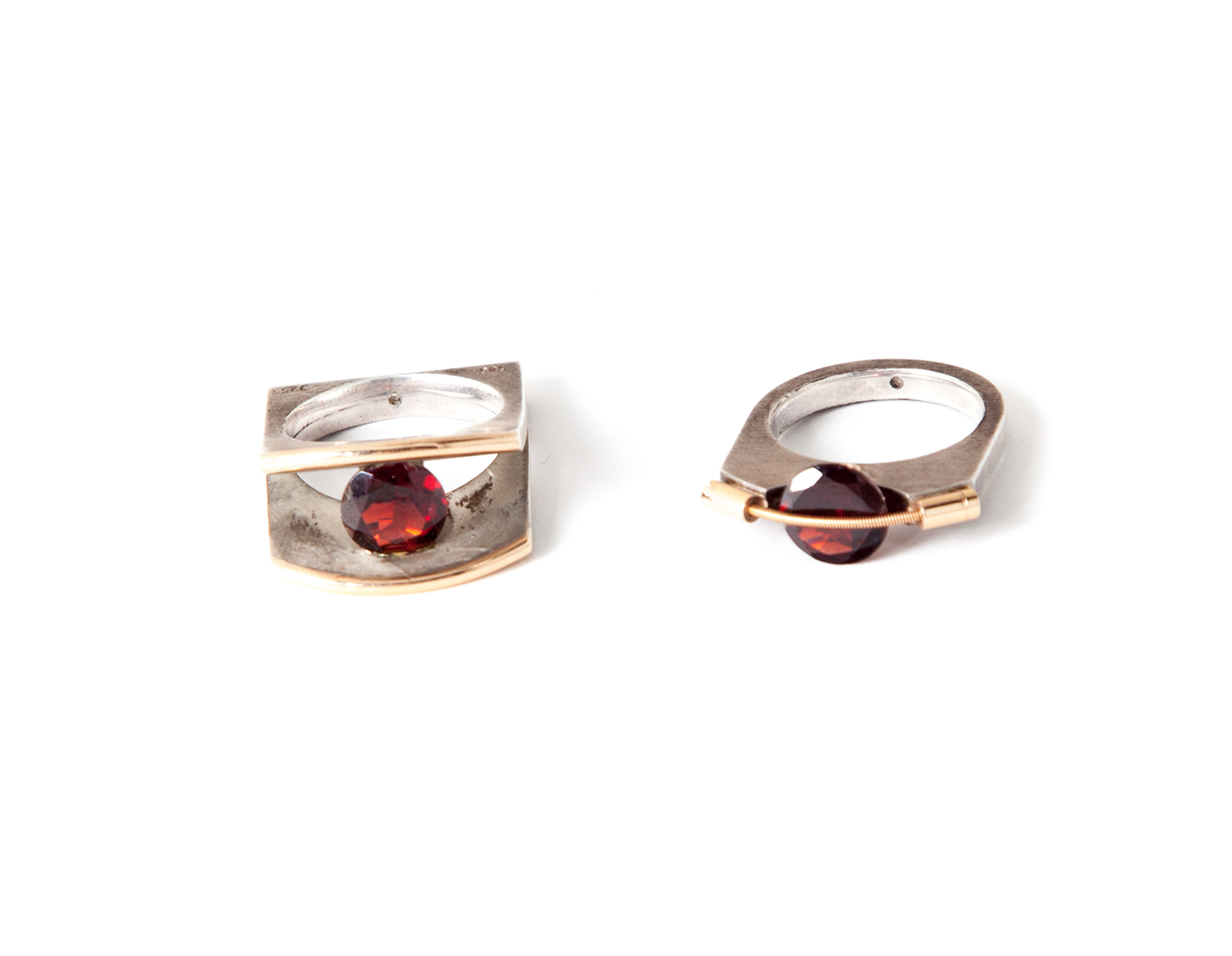 Appraisal: PAIR OF STERLING SILVER AND KARAT GOLD RINGS Poland st