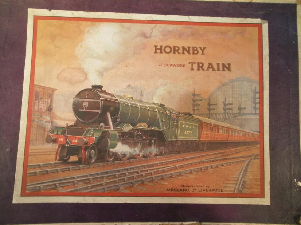 Appraisal: A Hornby clockwork train set of loco tender three wagons