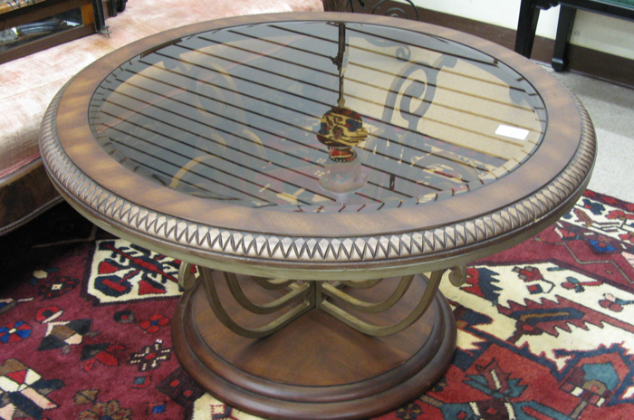 Appraisal: A CONTEMPORARY GLASS-TOP OAK AND WROUGHT IRON COCKTAIL TABLE having