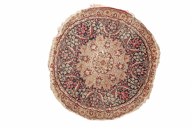 Appraisal: A KIRMAN CIRCULAR MAT with central medallion and foliate decoration