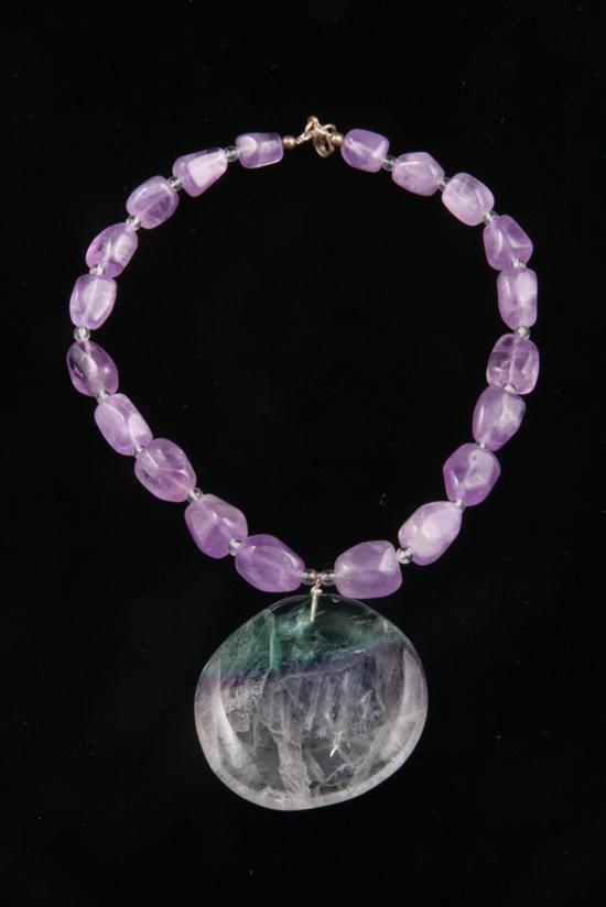 Appraisal: AMETHYST BEAD NECKLACE SUSPENDING HARDSTONE PENDANT Sold to Benefit the