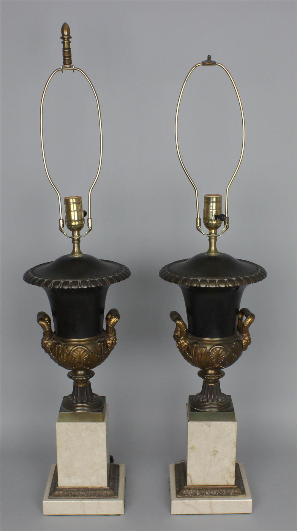 Appraisal: PAIR OF NEOCLASSICAL STYLE PATINATED METAL AND MARBLE URNS MOUNTED