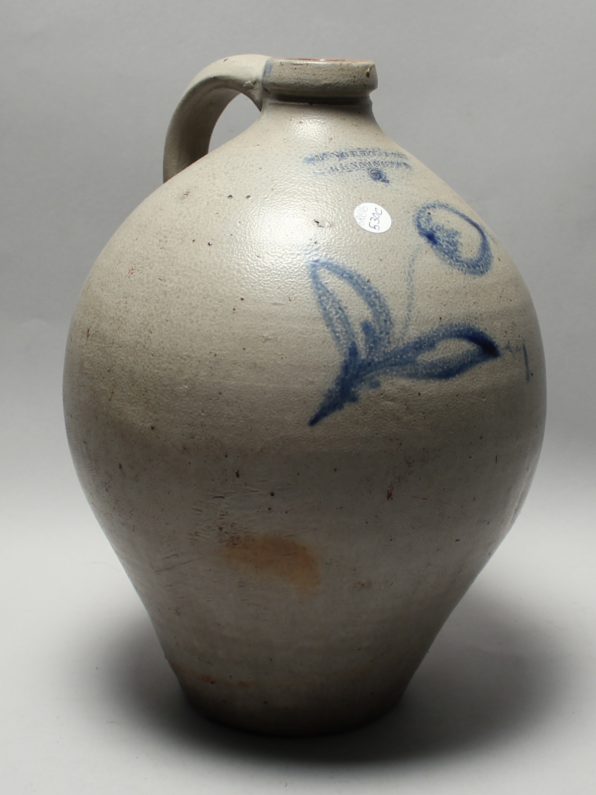 Appraisal: ANTIQUE AMERICAN OVOID STONEWARE JUG With blue floral decoration Stamped