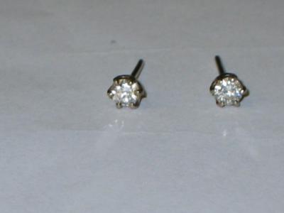 Appraisal: A PAIR OF DIAMOND DROP EARRINGS claw set in white