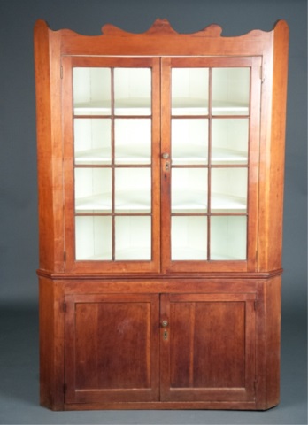 Appraisal: a Cherry Corner Cabinet Shaped pediment with two eight pane