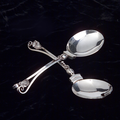 Appraisal: Georg Jensen serving spoon and fork with bud and ball