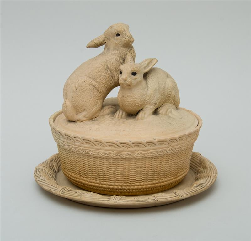 Appraisal: CONTINENTAL POTTERY RABBIT TUREEN COVER AND ASSOCIATED STAND Impressed 'C