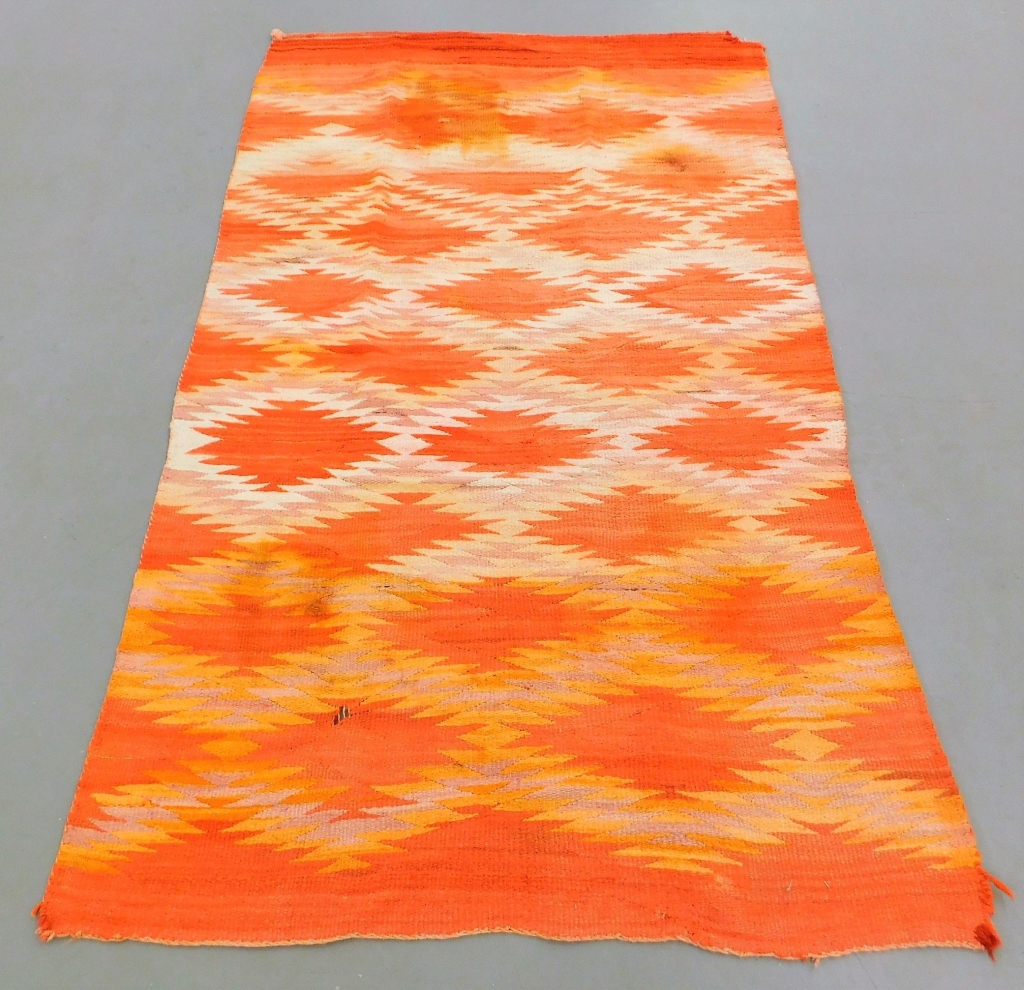 Appraisal: NAVAJO ORANGE AND CREAM GEOMETRIC FLAT WEAVE RUG United States