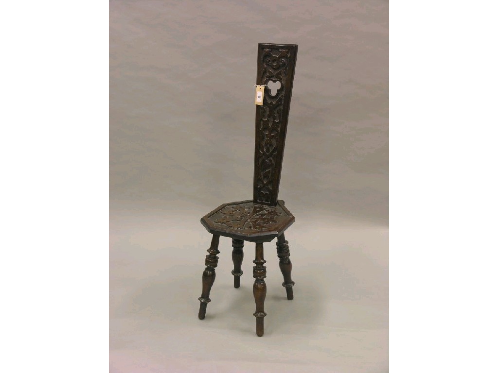 Appraisal: A carved beech spinning chair tall tapering back above octagonal