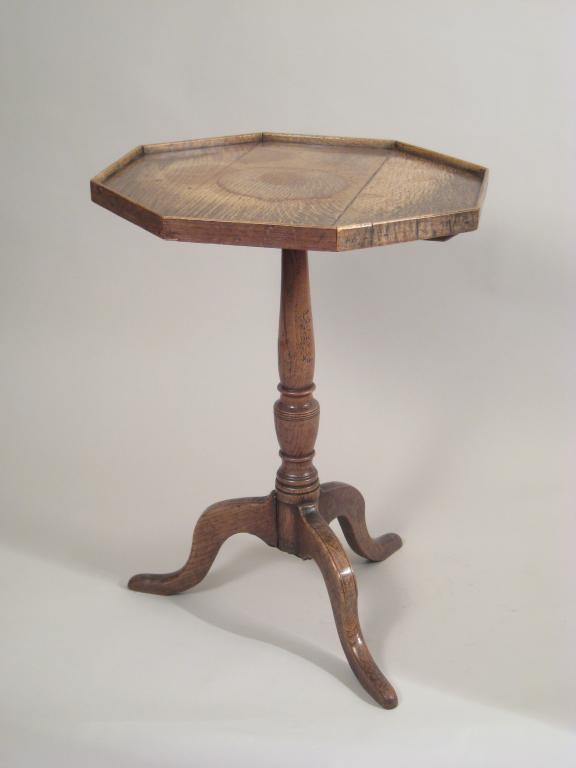 Appraisal: An octagonal oak Tripod Table with turned pillar and gallery