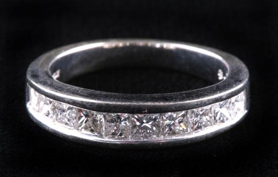 Appraisal: K WHITE GOLD DIAMOND BAND Row of graduated square-cut diamonds