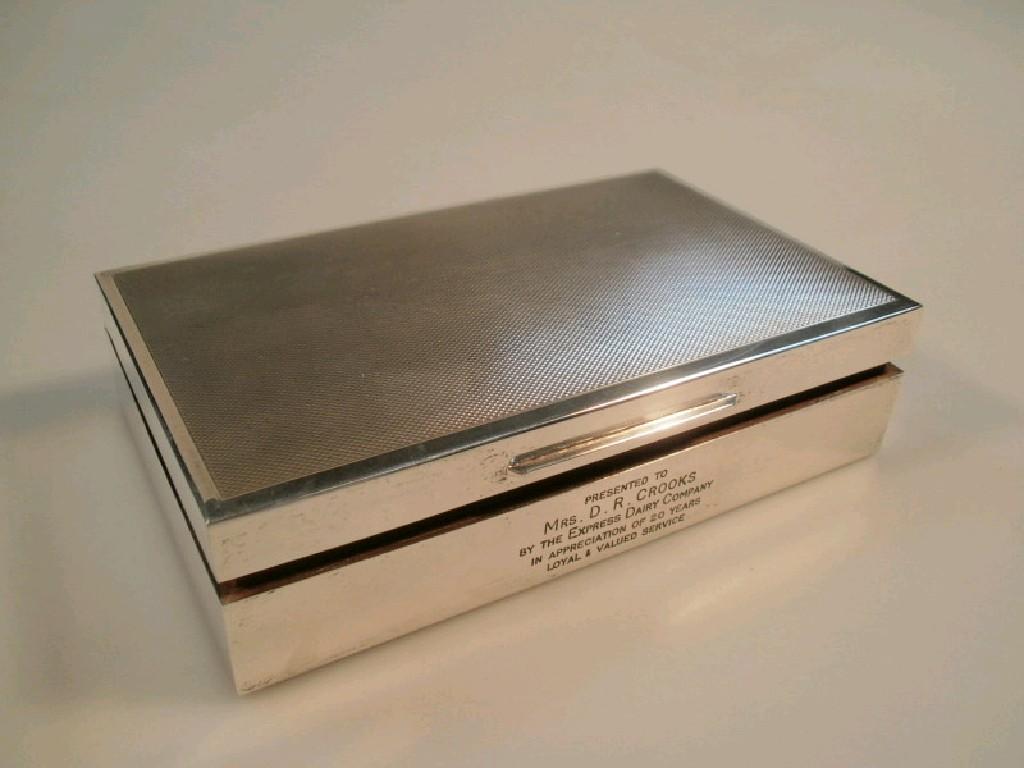 Appraisal: A presentation silver cigarette box with engine turned lid and