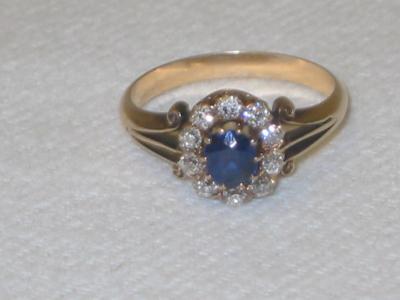 Appraisal: A SAPPHIRE AND DIAMOND CLUSTER RING the oval cut sapphire