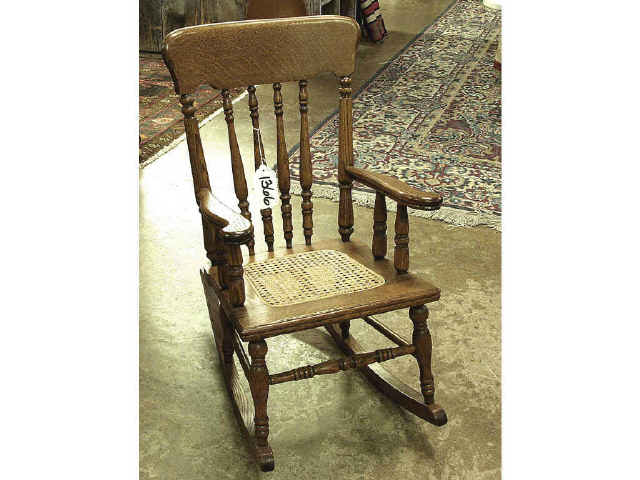 Appraisal: 's - golden oak spindle back child' rocker with excellent