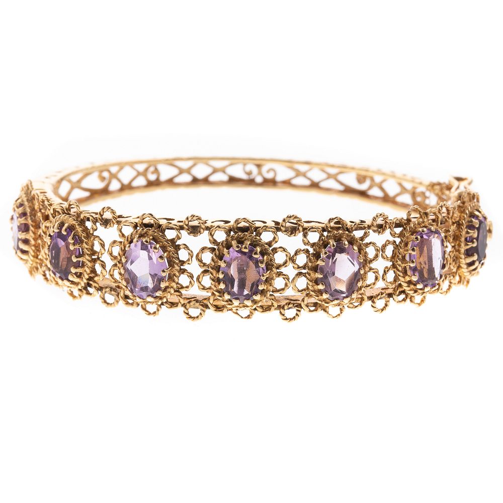 Appraisal: A K Twisted Gold Floral Amethyst Bangle K yellow gold