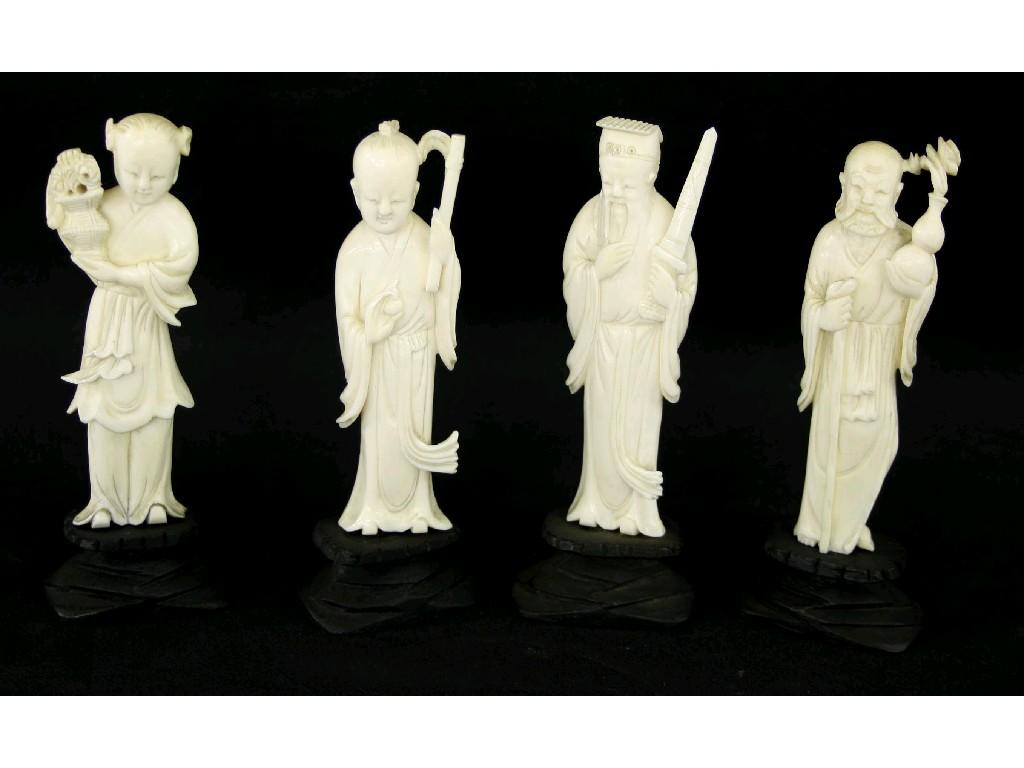 Appraisal: Group of four standing carved ivory figures modelled as dignitaries